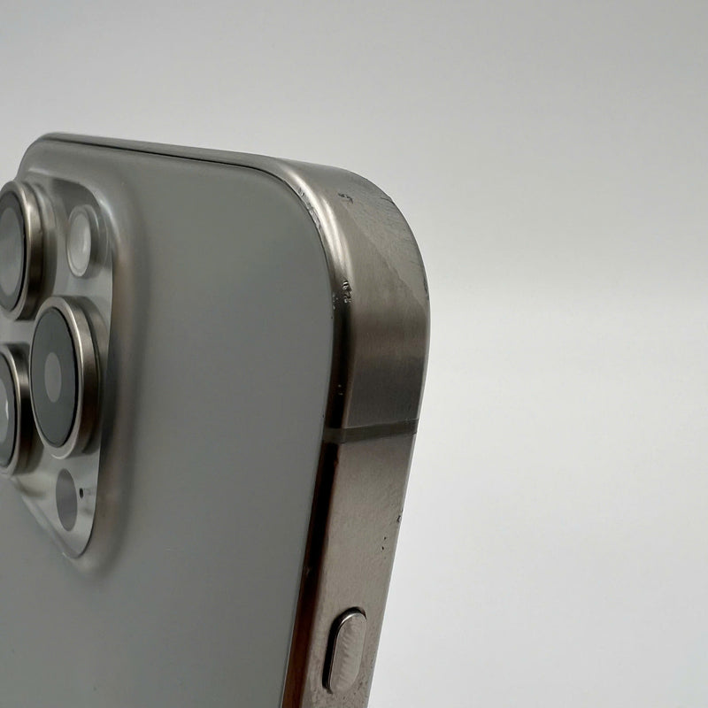 iPhone 15 Pro 128GB Natural 98% battery 86% International from DCM (No DCM sim - 0.5x spots, scratched edges, scratched orange edges) - HH7932 